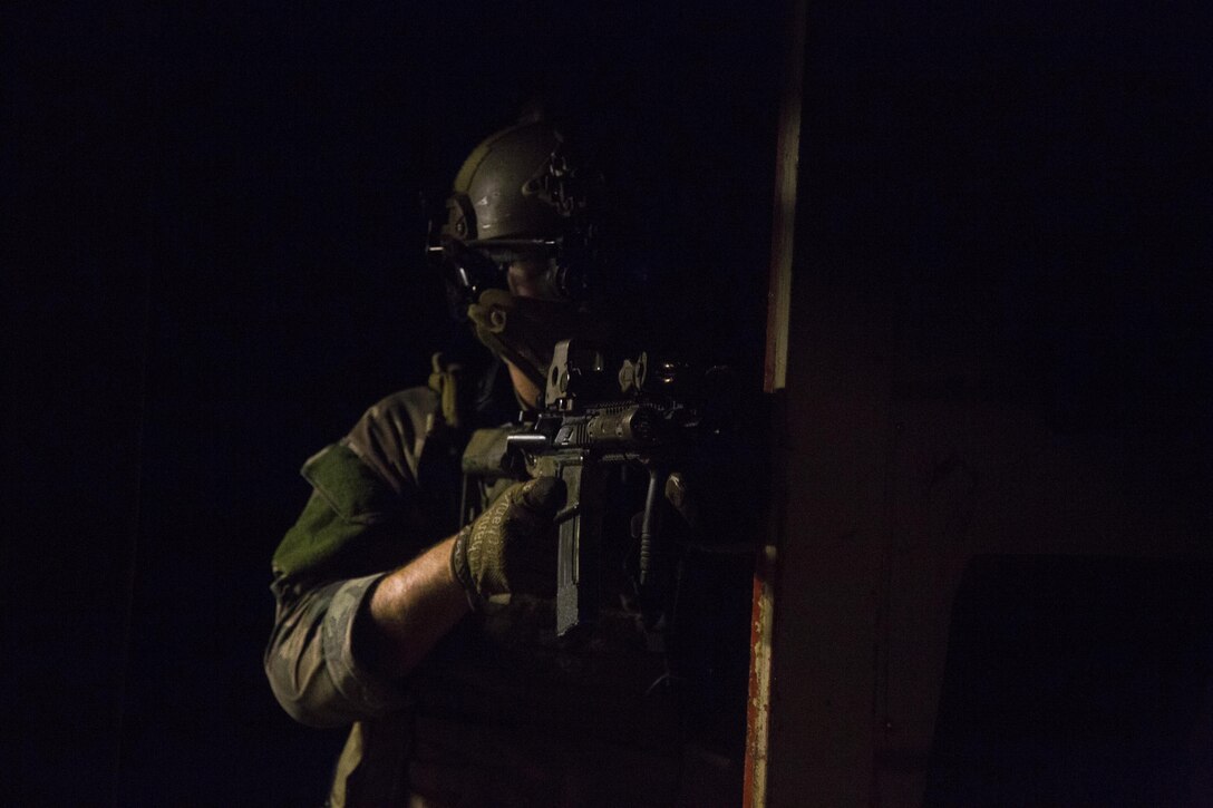 A Marine Raider with Marine Special Operations Company  Charlie, 1st Marine Raider Battalion, U.S. Marine Corps Forces, Special Operations Command, clears a vessel, while participating in Visit, Board, Search and Seizure training, during a Company Collective Exercise, Oct. 15, 2015, in San Diego, Calif.