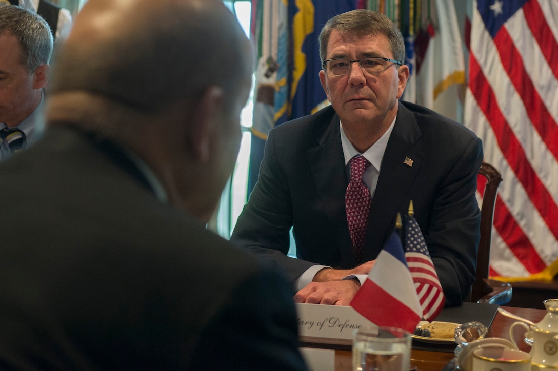 U.S. Defense Secretary Ash Carter speaks with French Defense Minister Jean-Yves Le Drian during a meeting at the Pentagon, Nov. 24, 2015. DoD photo by Air Force Senior Master Sgt. Adrian Cadiz