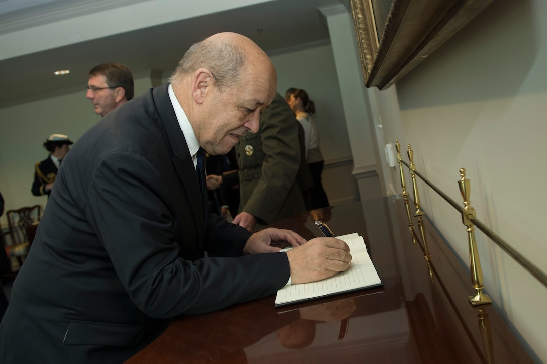 French Defense Minister Jean-Yves Le Drian signs a guest book at the Pentagon, Nov. 24, 2015. DoD photo by Air Force Senior Master Sgt. Adrian Cadiz