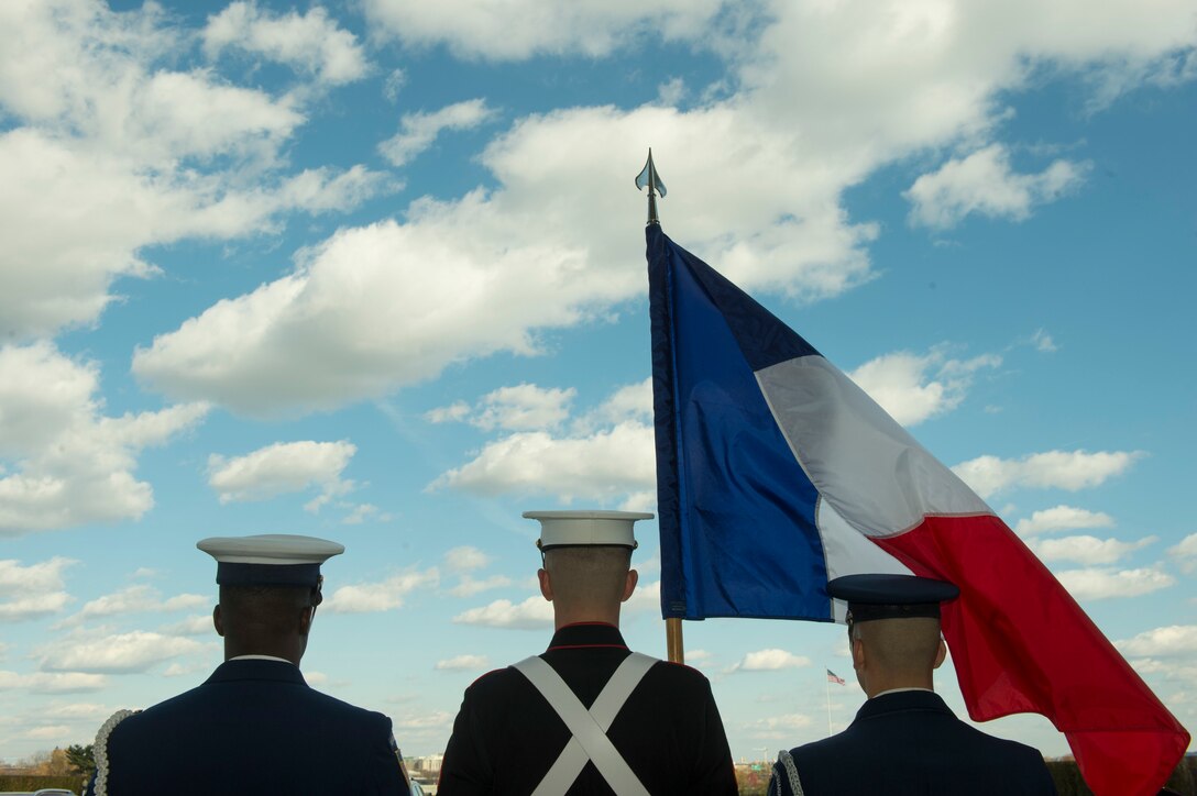 A joint color guard stands in place as U.S. Defense Secretary Ash Carter hosts an honor cordon welcoming French Defense Minister Jean-Yves Le Drian to the Pentagon, Nov. 24, 2015. DoD photo by Air Force Senior Master Sgt. Adrian Cadiz