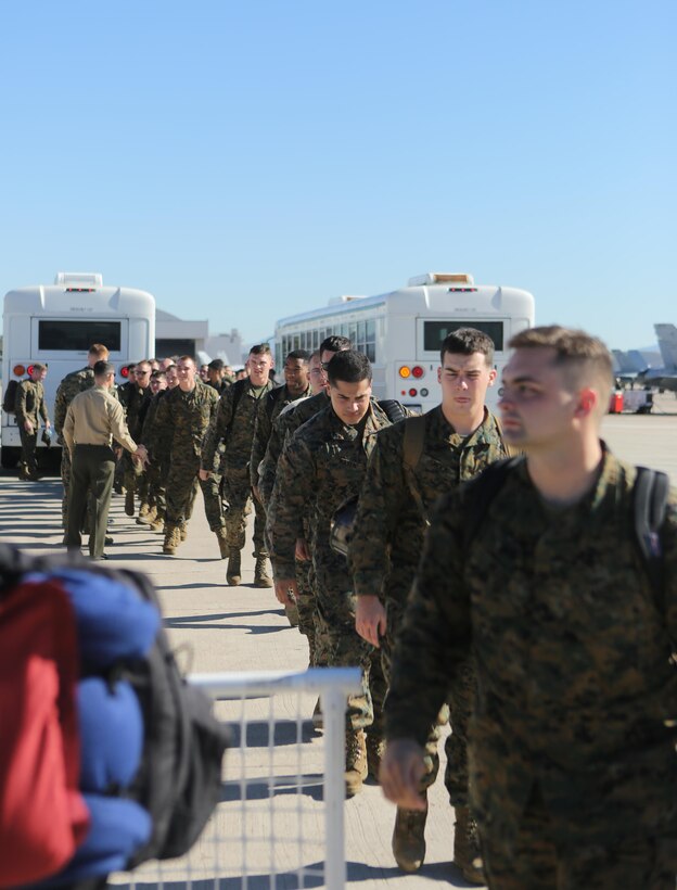 Marines with Marine Heavy Helicopter Squadron (HMH) 462 unload the buses as they return from a seven-month deployment aboard Marine Corps Air Station Miramar, Calif., Nov. 12.  The Marines were greeted by family and friends, who had patiencely been waiting for their arrival. (U.S. Marines photo by Lance Cpl. Kimberlyn Adams/Released)