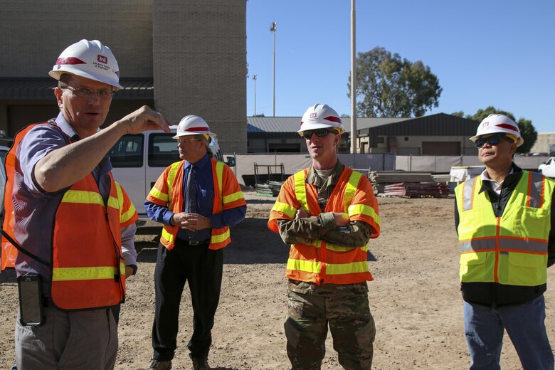 Rob Crist (left), resident engineer at Luke Air Force Base, briefs Los Angeles District Commander Col. Kirk Gibbs Nov. 19. Crist updated Gibbs on the status of aviation maintenance unit facilities built in support of the F-35 beddown at Luke.