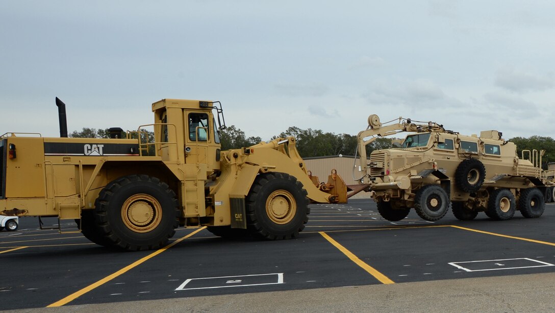 William Palmer, engineering equipment operator, Marine Corps Logistics Command, prepares to park a mine-resistant ambush protected vehicle in an incoming equipment lot. The vehicle was requested by Production Plant Albany staff to be rebuilt.