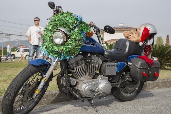 Japanese motorcycle clubs and motorcycle riders from the air station gathered at the Marine Thrift Store for the third-annual Toy Drive and Motorcycle Rally at Marine Corps Air Station Iwakuni, Japan, Nov. 22, 2015. Station residents and local Japanese donated toys for Japanese orphans and enjoyed decorated bikes and the roar of engines as the motorcyclists went on a Thunder Ride around base.
