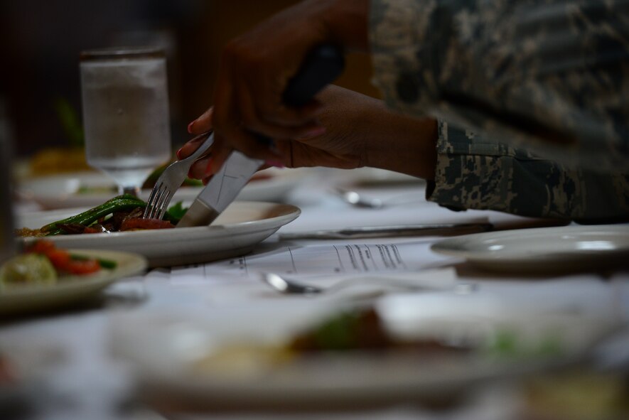 Judges cut into their meals during the food portion of the bi-annual Force Support Squadron Challenge held at Osan Air Base, Republic of Korea, Nov. 20, 2015. FSS Airmen from Kunsan and Osan AB participated in competitions that consisted of fitness, food, lodging challenges as well as a jeopardy round, the points from each event were added up to decide the winner, the 8th FSS from Kunsan AB. (U.S. Air Force photo/Staff Sgt. Amber Grimm)
