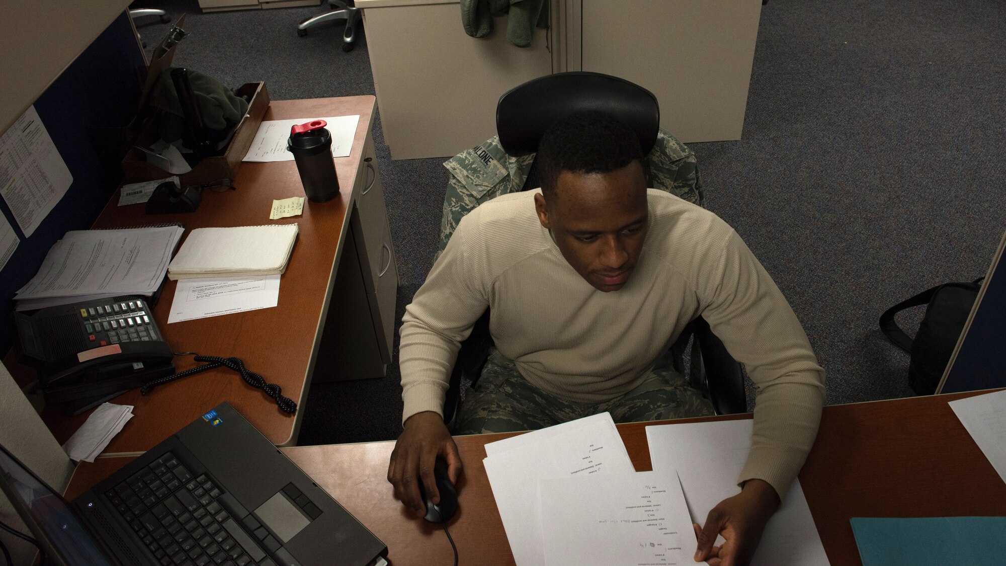 U.S. Air Force Senior Airman Keathon Malone Jr., a 354th Civil Engineer Squadron requirements and optimization specialist, works on base maps Nov. 16, 2015, at Eielson Air Force Base, Alaska. Malone consolidated collected data from various shops to make utility-related maps. (U.S. Air Force photo by Airman 1st Class Cassandra Whitman/Released)