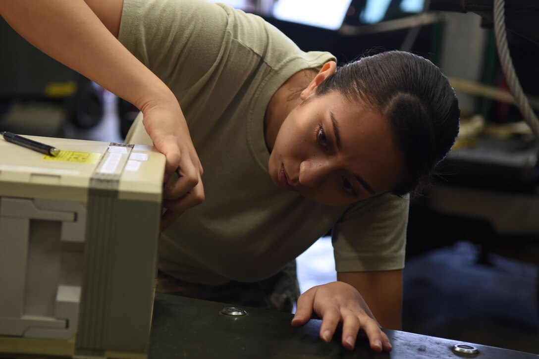 Airman 1st Class Alexis Kogel, 4th Component Maintenance Squadron test, measurement and diagnostic equipment technician, inserts a pressure value into a pressure controller, Nov. 19, 2015, at Seymour Johnson Air Force Base, North Carolina. Even when the jets aren’t flying, the Airmen of the precision measurement equipment lab work around-the-clock to service equipment for F-15E Strike Eagles and other base entities. (U.S. Air Force photo/Airman Shawna L. Keyes)