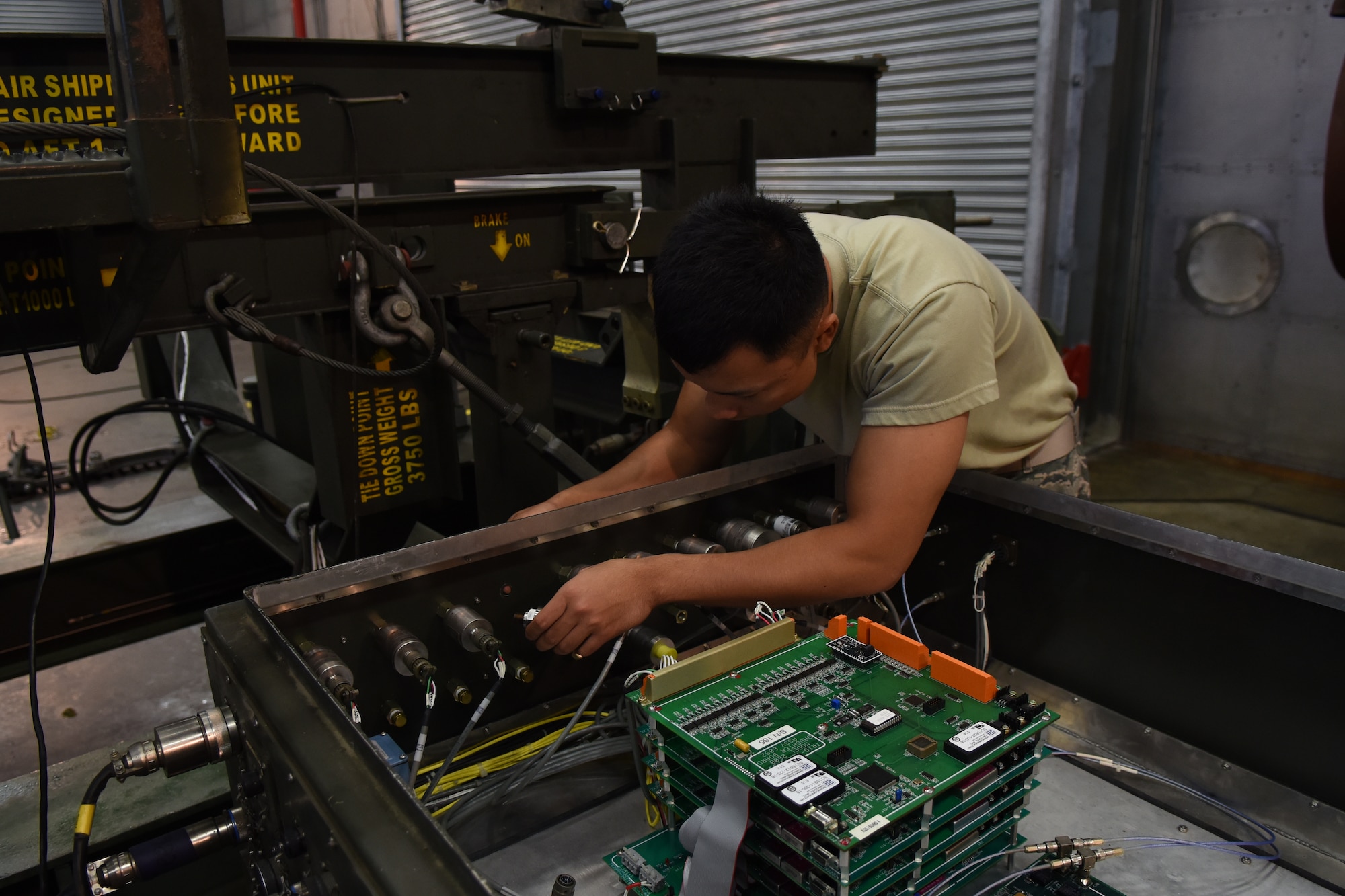 Senior Airman Ronald Medina, 4th Component Maintenance Squadron test, measurement and diagnostic equipment technician, installs a pressure transducer at a test cell, Nov. 19, 2015, at Seymour Johnson Air Force Base, North Carolina. As well as conducting in-house calibrations, technicians also go to various units throughout the base to perform standardizations on-site. (U.S. Air Force photo/Airman Shawna L. Keyes) 