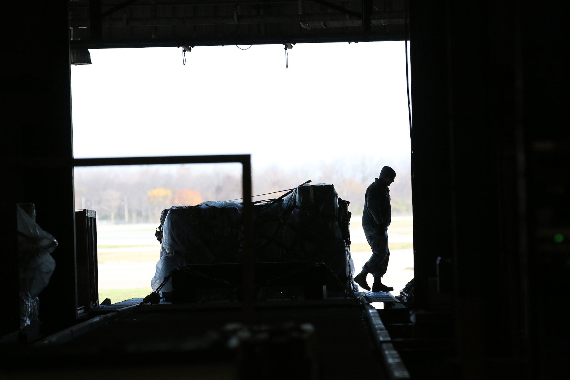 WRIGHT-PATTERSON AIR FORCE BASE, Ohio -  A lone 87th Aerial Port Squadron Airman,  walks away from a secured pallet waiting to be loaded and transportated by a  C-17 Globemaster III during training held on the Nov. 6, 2015 unit training assembly. (U.S. Air Force photo /Tech. Sgt. Patrick O’Reilly)