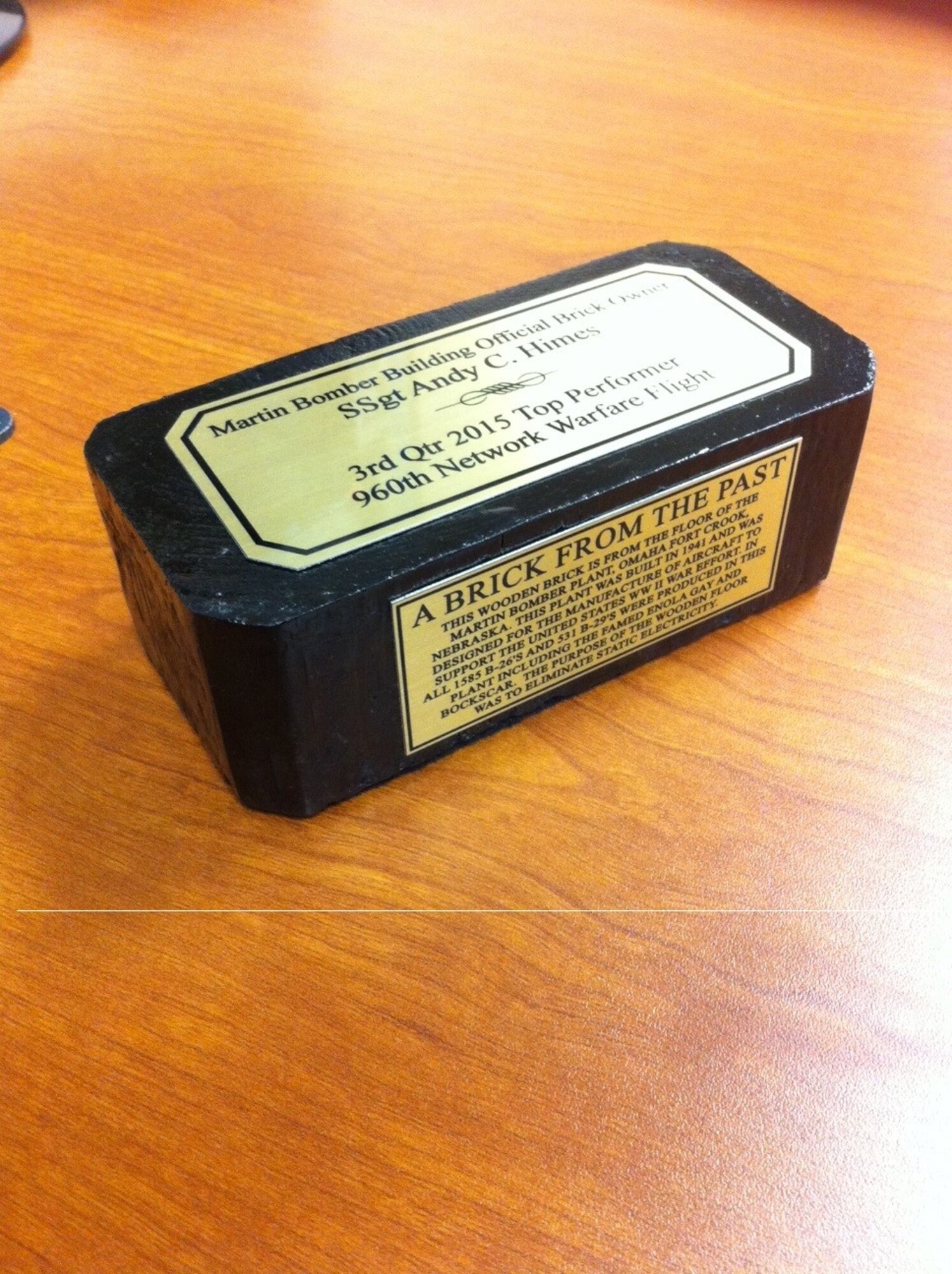 For quarterly awards, Outstanding Airman are awarded wooden bricks from the floor of the original Glen L. Martin Nebraska Bomber Plant that produced the Enola Gay and Bock’s Car. (Courtesy photo)  
