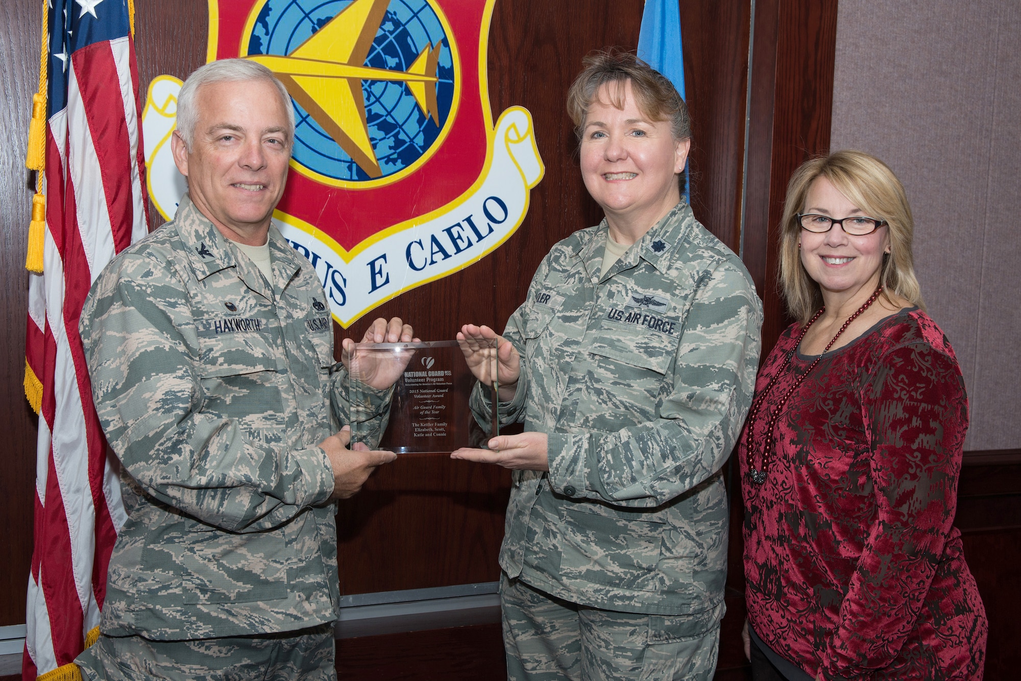 Lt. Col. Elizabeth Kettler receives the 2015 Air National Guard Family of the Year award from Col. Douglas Hayworth, commander of the 137th Mission Support Group, Oklahoma Air National Guard. Also pictured is Pam Reeds, lead child and youth program coordinator for the Oklahoma National Guard.