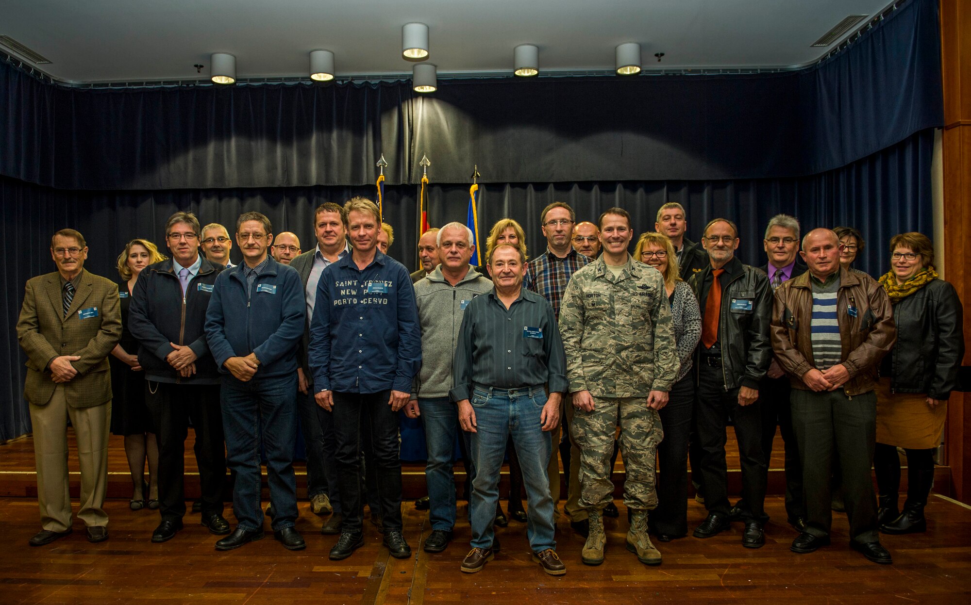 Recipients of the Civilian Length of Service award stand with U.S. Air Force Col. Steve Horton, 52nd Fighter Wing vice commander, after the ceremony in Club Eifel at Spangdahlem Air Base, Germany, Nov. 20, 2015. The 52nd FW recognized 20 civilian employees with a Length of Service Recognition ceremony for their dedication and continued efforts in support of Team Eifel. The recipients served 20-45 years of continued service to the installation. (U.S. Air Force photo by Airman 1st Class Timothy Kim/Released)