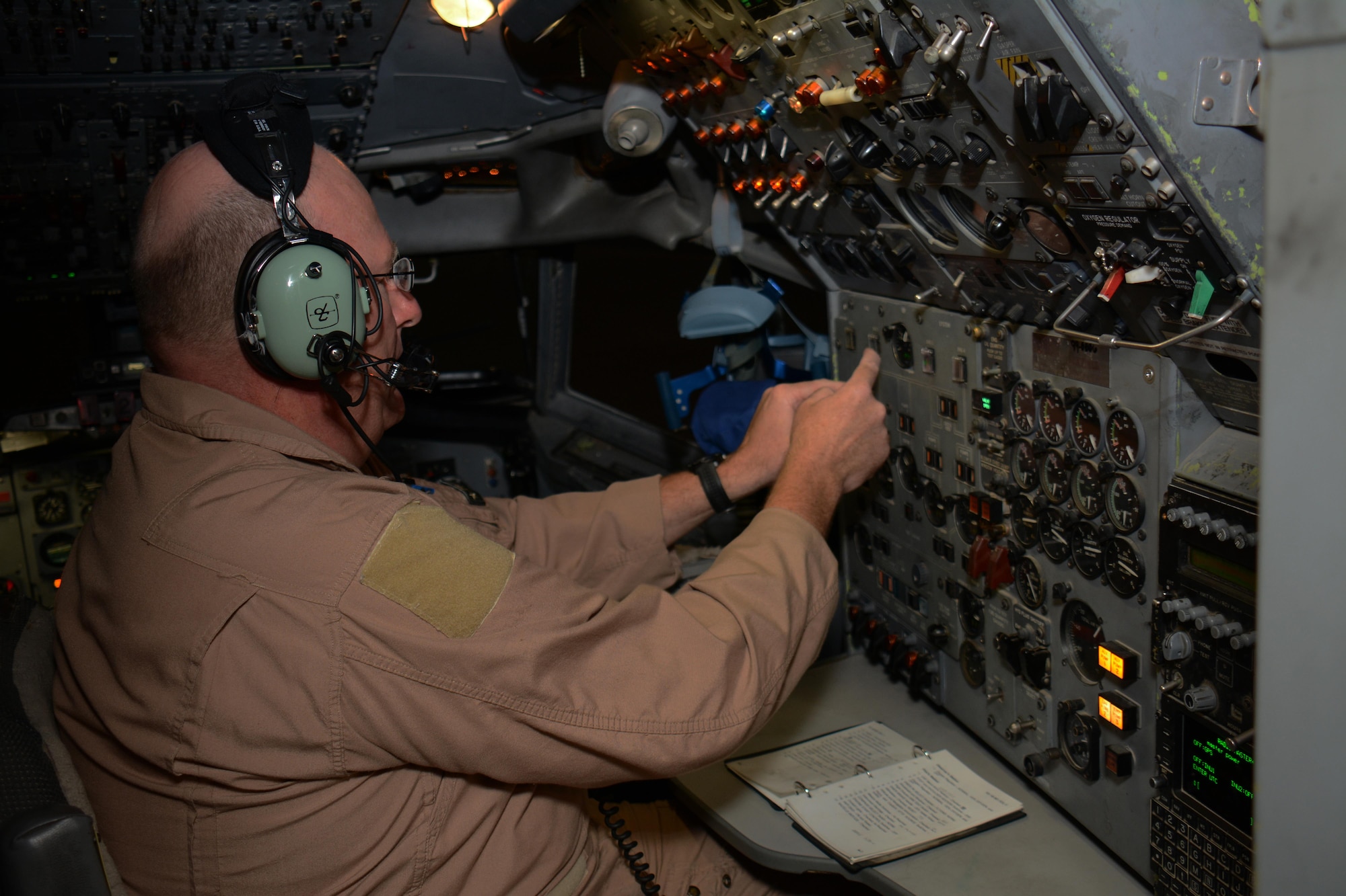 Master Sgt. Curtis Stark, 7th Expeditionary Airborne Command and Control Squadron superintendent, conducts a pre-flight inspection in the cockpit of an E-8C Joint Surveillance Target Attack Radar System aircraft at Al Udeid Air Base, Qatar Nov. 14. Stark has deployed 17 times with JSTARS aircraft in support of contingency operations and has accumulated more than 4,000 combat flying hours. After nearly 30 years of service he plans to retire from the Air Force in March 2016. (U.S. Air Force photo by Tech. Sgt. James Hodgman/Released