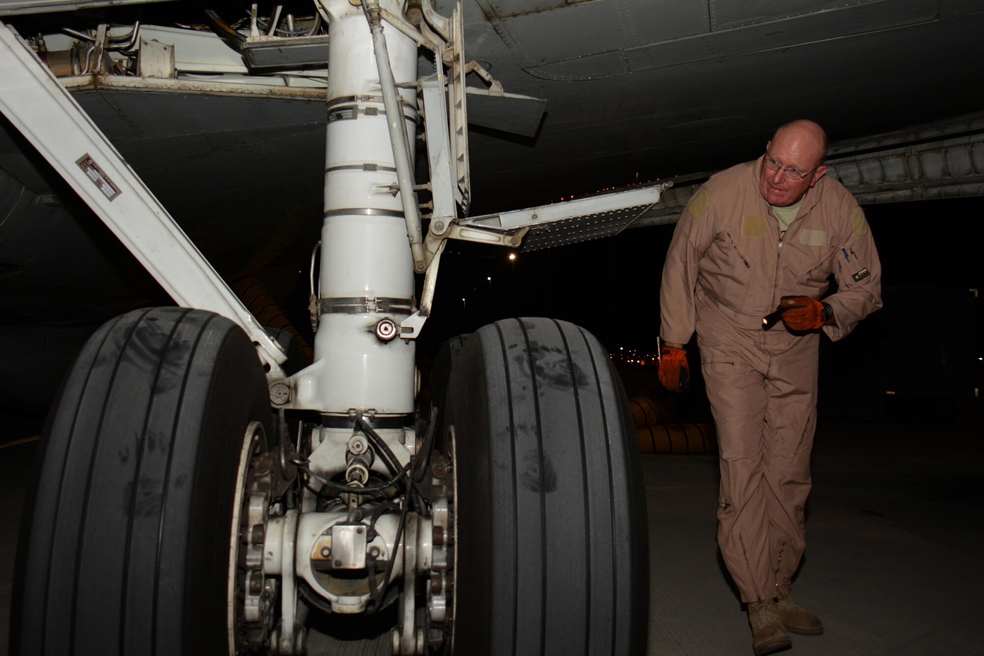 Master Sgt. Curtis Stark, 7th Expeditionary Airborne Command and Control Squadron superintendent, conducts a pre-flight inspection on the exterior of an E-8C Joint Surveillance Target Attack Radar System aircraft at Al Udeid Air Base, Qatar Nov. 14. Stark has deployed 17 times with JSTARS aircraft in support of contingency operations and has accumulated more than 4,000 combat flying hours. After nearly 30 years of service he plans to retire from the Air Force in March 2016. (U.S. Air Force photo by Tech. Sgt. James Hodgman/Released)