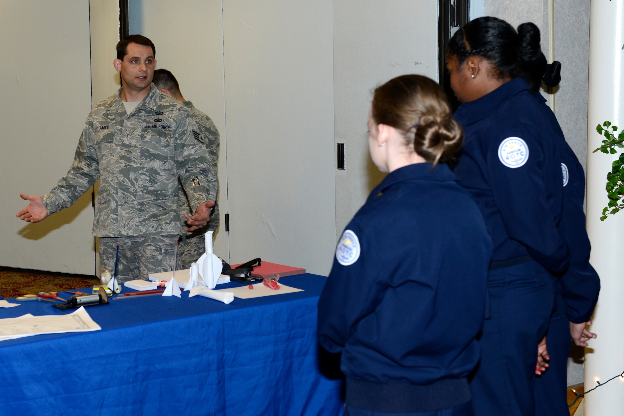 Staff Sgt. Daniel Parks, 22nd Contracting Squadron contract administrator, explains how the 22nd CONS uses STEM principles when creating contracts, Nov. 12, 2015, McConnell Air Force Base, Kan. More than 150 students from local schools visited McConnell to learn about how Airmen apply the pillars of STEM to their daily mission. (U.S. Air Force photo/Senior Airman Trevor Rhynes)