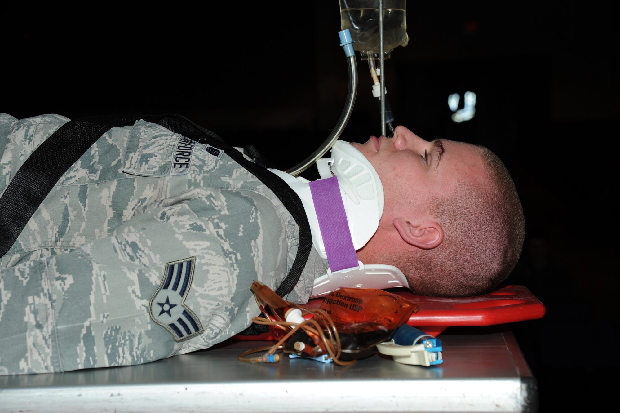 Senior Airman Jordan Gaines, 22nd Communications Squadron cyber assurance technician, rests on a table during a driving safety presentation, Nov. 18, 2015, at McConnell Air Force Base, Kan. The “Street Smart” presentation led the audience through a scenario from the initial decisions of improper driving through post-accident emergency response medical care. (U.S. Air Force photo/Airman Jenna K. Caldwell)