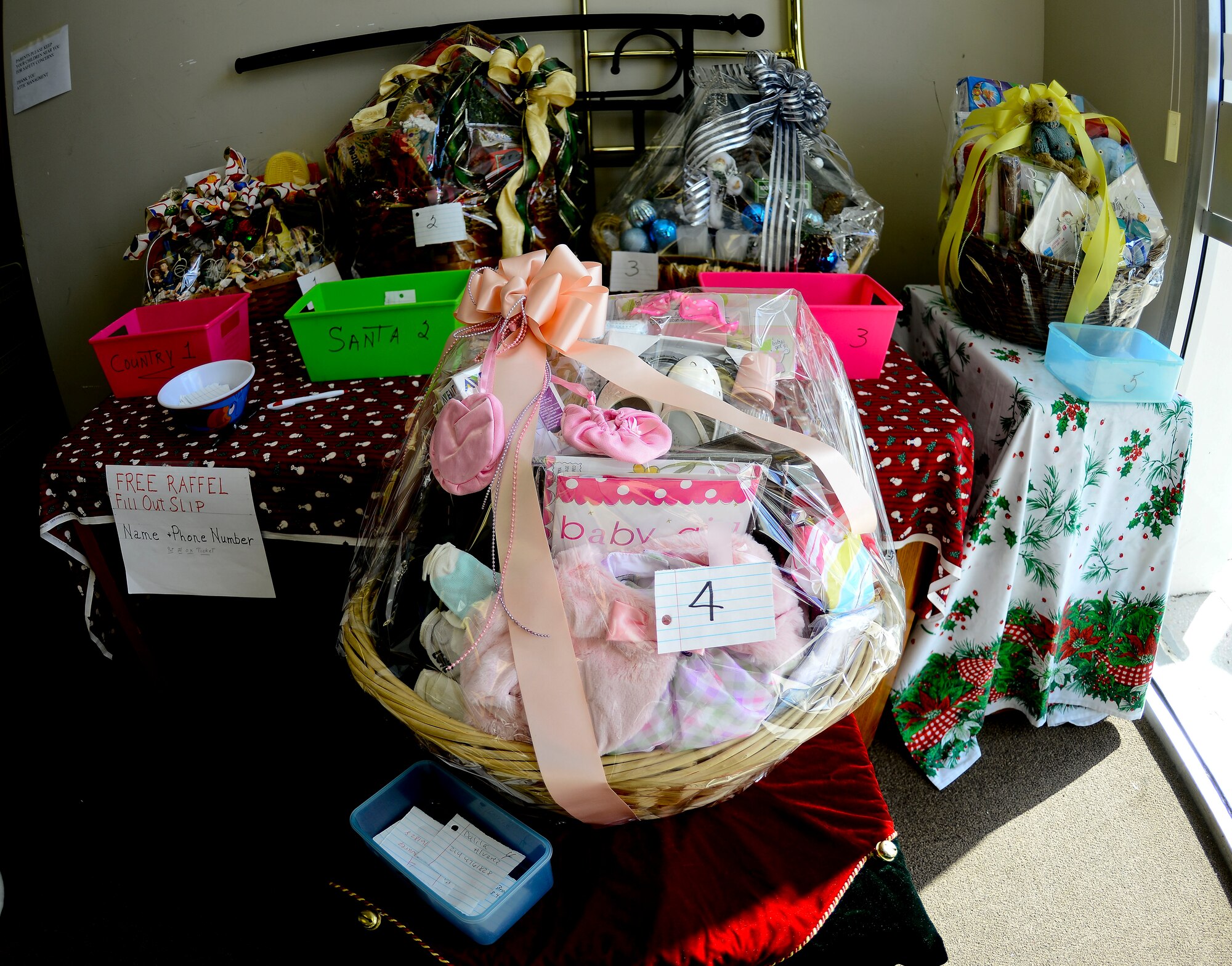 Five gift baskets sit on a table as part of  a free raffle hosted by the Airman’s Attic Nov. 17, 2015 at MacDill Air Force Base, Fla. The Airmen’s Attic created the baskets as an incentive to visit the Airmen’s Attic, which collects donations for service members E-1 through E-6. (U.S. Air Force photo by Senior Airman Melanie Hutto) 