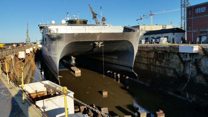 The USNS Spearhead (T-EPF-1), a Joint High Speed Vessel class ship, is in dry dock Oct. 20, 2015, at the Navy port in Charleston, S.C. The EPF-1 is a high-speed, shallow draft, surface ship able to transport  payloads of more than 600 short tons or a fully equipped company-sized unit rapidly over intra-theater distances. These company-sized units can embark and debark as intact military formations with vehicles and weapons ready for immediate employment. . The crew is able to quickly reconfigure loads as mission requirements change. The JHSV class of ship is an auxiliary (non-warship) vessel designed to operate in non-threatening environments. In higher threat environments, it will operate under the protection of warships or other joint assets. JHSV class ships are being built to American Bureau of Shipbuilding (ABS) High Speed Naval Craft (HSNC) standards, and will not be shock hardened. As an intra-theater connector, JHSVs will be capable of self-deploying to theaters of operations and then moving forces and supplies within the theater.

The ship is operated by the US Navy's Military Sealift Command with a crew of civil service mariners, who rotate about every four months.

The local Military Sealift Command office provides logistical, husbanding support and operational oversight to all MSC (USNS) vessels.  The ship’s current master is Capt. Doug Casavant.

(Courtesy photo by Chief engineer J. Hansen)
