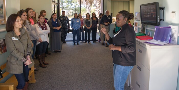 The Joint Base Charleston leadership spouses visited the Air Base Child Development Center director on JB Charleston – NWS, S.C., on Nov. 20, 2015 and Alexandria Goodwine, CDC director, describes how the CDC functions to help JB Charleston members’ children to grow mentally, emotionally and spiritually. The spouses visited several classrooms and observed how the teachers were working with the children. (U.S. Air Force photo/Airman 1st Class Thomas T. Charlton)