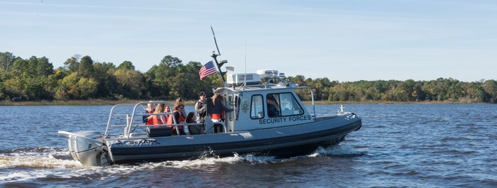 Riding on security forces boats, the Joint Base Charleston senior leadership spouses toured JB Charleston – NWS, S.C. they saw the Navy Nuclear Power Training school’s submarines on Nov. 20, 2015. Because each boat’s capacity was  a maximum of 10 people per boat, the spouses were divided into three separate groups. (U.S. Air Force photo/Airman 1st Class Thomas T. Charlton)