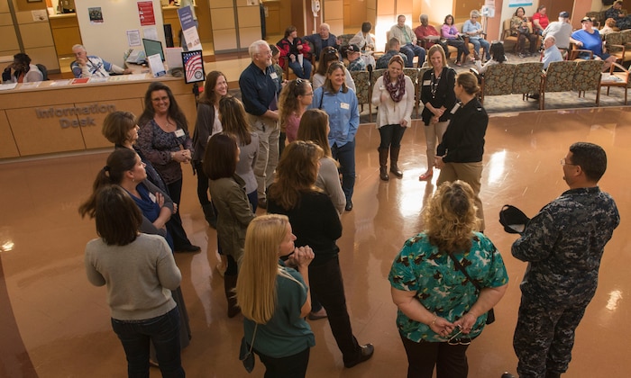 Navy Captain Rosemary Malone, Naval Health Clinic Charleston executive officer, describes the various services provided by the clinic for the Joint Base Charleston senior leadership spouses on JB Charleston – NWS, S.C., on Nov. 20, 2015. The JB Charleston senior leadership spouses were given a tour to help immerse themselves in what goes on at JB Charleston. They were trying to better understand how the base works to give positive feedback to their spouses. (U.S. Air Force photo/Airman 1st Class Thomas T. Charlton)