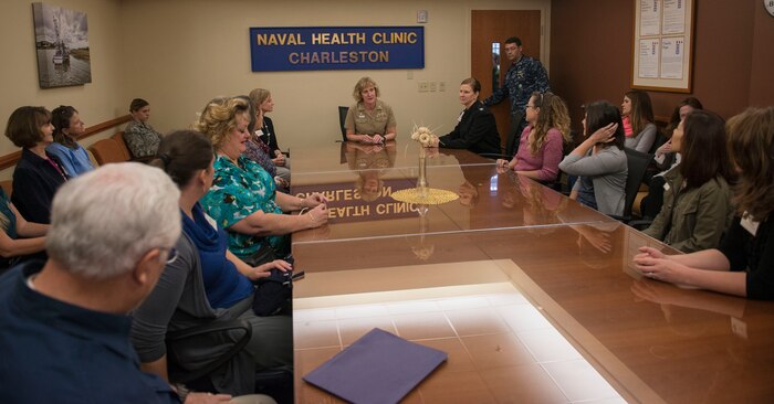 Navy Captain Annie  Maley, Naval Health Clinic Charleston commanding officer, welcomes the Joint Base Charleston senior leadership spouses with a briefing describing operations at the NHCC on JB Charleston – NWS, S.C., on Nov. 20, 2015. Maley explained that no matter your branch of service, the Air Force and Naval Health Clinics treat any military members. (U.S. Air Force photo/Airman 1st Class Thomas T. Charlton)