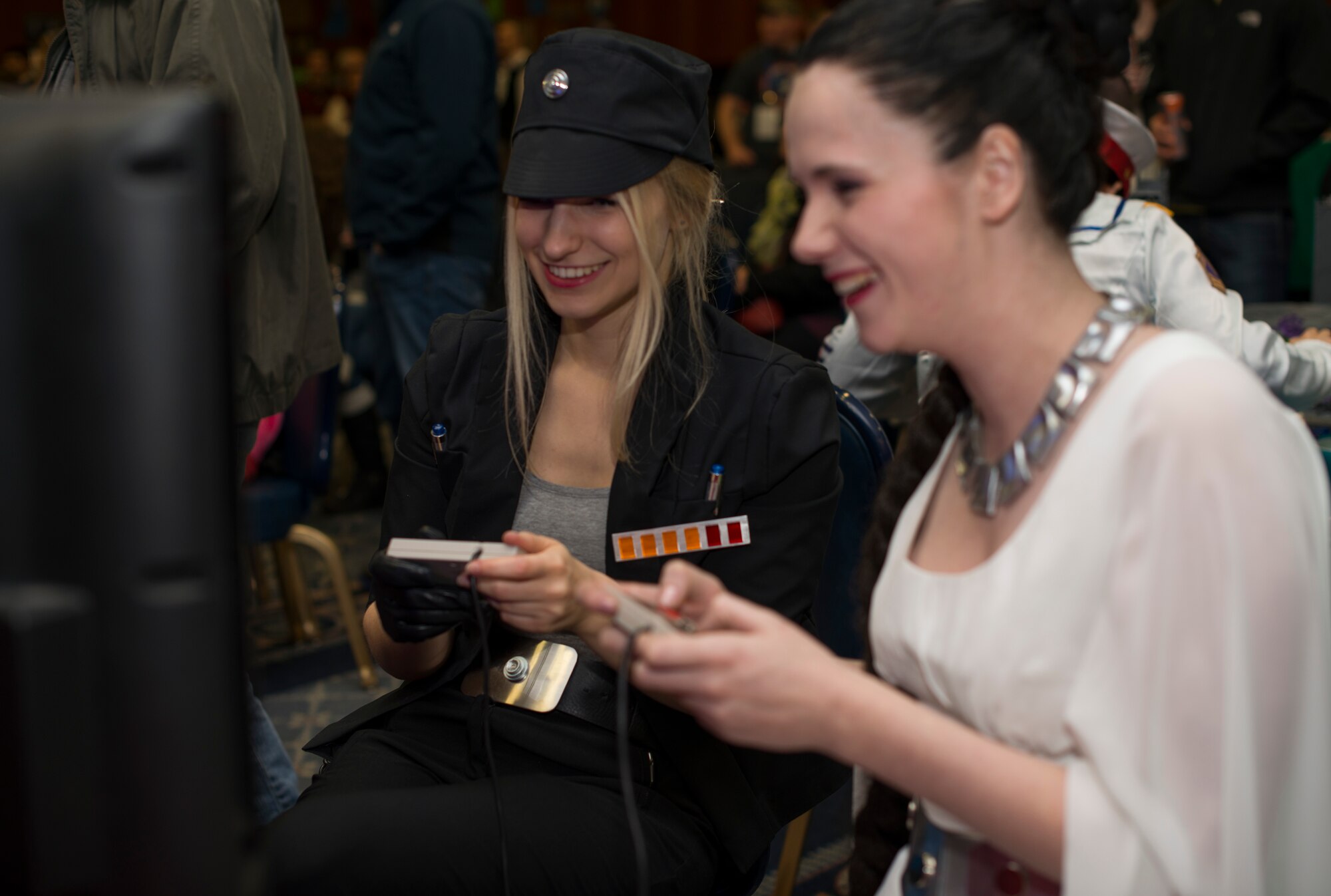 Members of the community play video games during Operation Sci-Fi Con at Spangdahlem Air Base, Germany, Nov. 23, 2015. Members participated in laser sword fights and collector discussion groups in addition to playing video games. (U.S. Air Force photo by Staff Sgt. Christopher Ruano/Released)