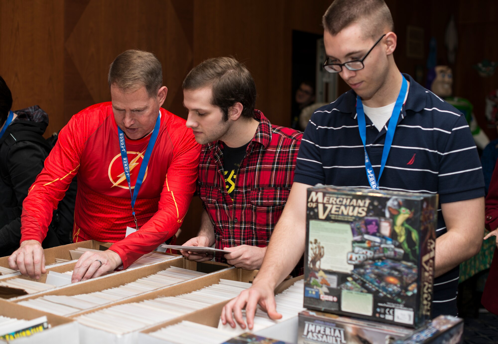 Community members sort through boxes of comics during Operation Sci-Fi Con at Spangdahlem Air Base, Germany, Nov. 23, 2015. Vendors were present to sell different science fiction-themed merchandise. (U.S. Air Force photo by Staff Sgt. Christopher Ruano/Released)

