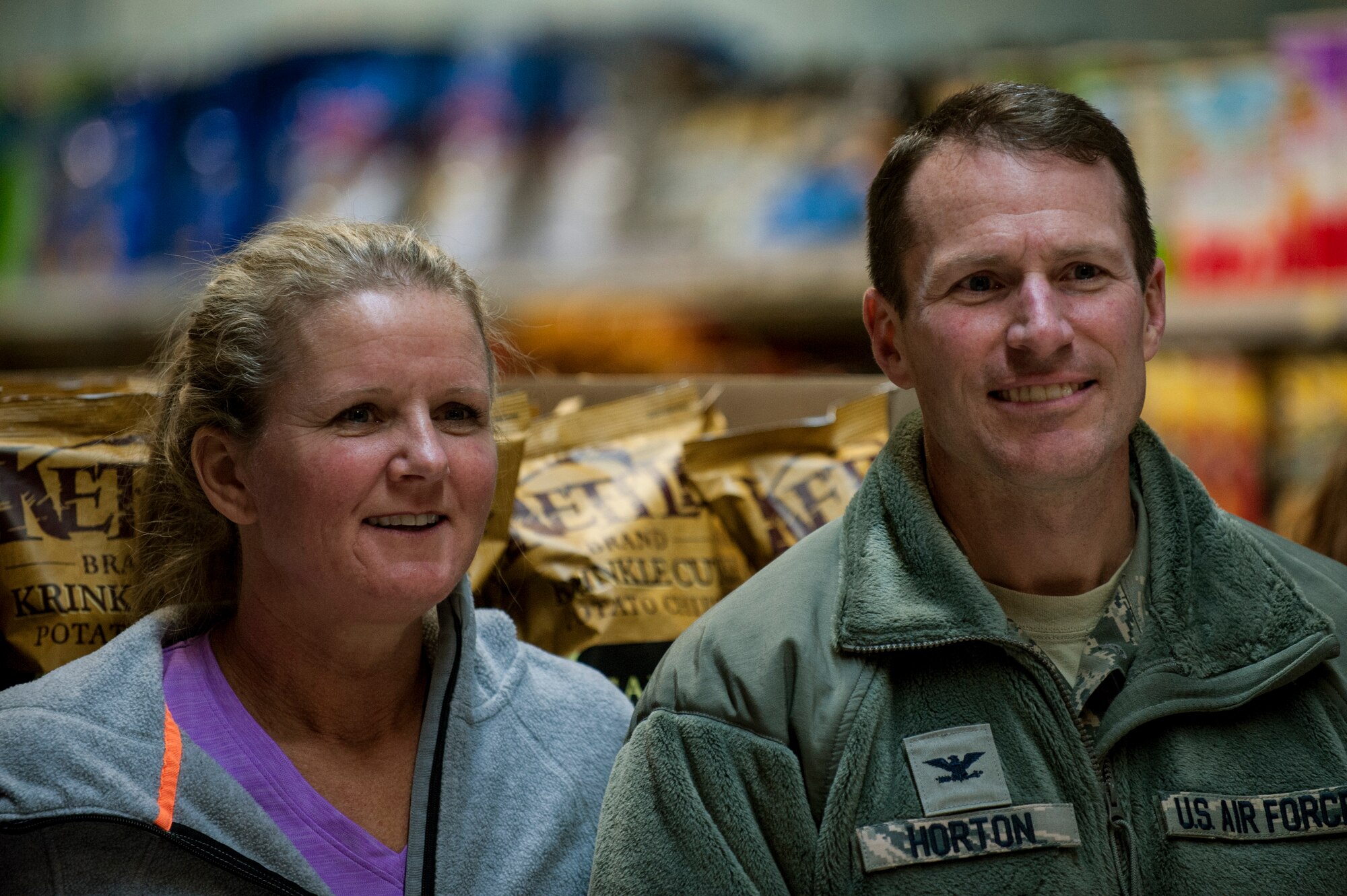 U.S. Air Force Col. Steven Horton, 52nd Fighter Wing vice commander, and his wife watch the 2015 Commissary Sweep at Spangdahlem Air Base, Germany Nov. 23, 2015. The Spangdahlem Spouses and Enlisted Members Club hosted the event as a way to give back to the community. (U.S. Air Force photo by Senior Airman Rusty Frank/Released)