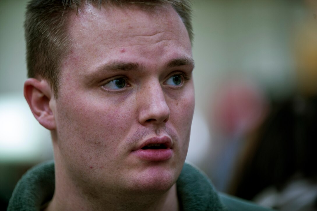 U.S. Army Sgt. Matthew O'Connor, 52nd Medical Group NCO in charge of the Veterinary Clinic treatment facility, watches as groceries are scanned during the 2015 Commissary Sweep at Spangdahlem Air Base, Germany, Nov. 23, 2015. The Contestants tried to stay as close to the budgeted money to win first place for the event. (U.S. Air Force photo by Senior Airman Rusty Frank/Released)