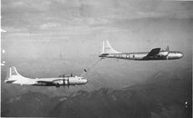 A KB-29 Superfortress (tanker) from the 509th Bombardment Group (BG) at Roswell Army Air Field, N.M., refuels an aircraft mid-flight. The 509th BG was chosen to pioneer aerial refueling when it received the KB-29 in 1948. (Courtesy photo)