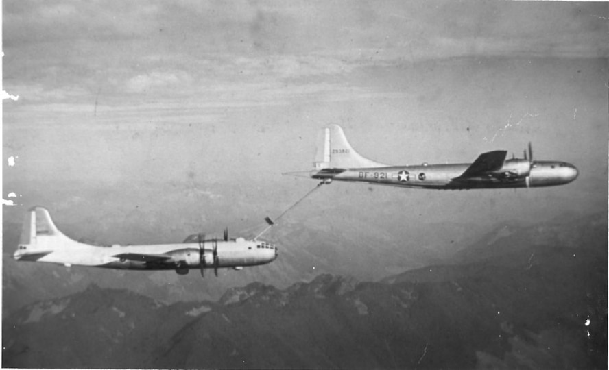 A KB-29 Superfortress (tanker) from the 509th Bombardment Group (BG) at Roswell Army Air Field, N.M., refuels an aircraft mid-flight. The 509th BG was chosen to pioneer aerial refueling when it received the KB-29 in 1948. (Courtesy photo)