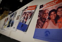 The Airman and Family Readiness Center made informational booklets available to military dependents during Operation Spirit at Whiteman Air Force Base, Mo., Nov. 21, 2015. The event was designed to help deployed families form a support network while they are separated from their family members. (U.S. Air Force photo by Senior Airman Sandra Marrero)