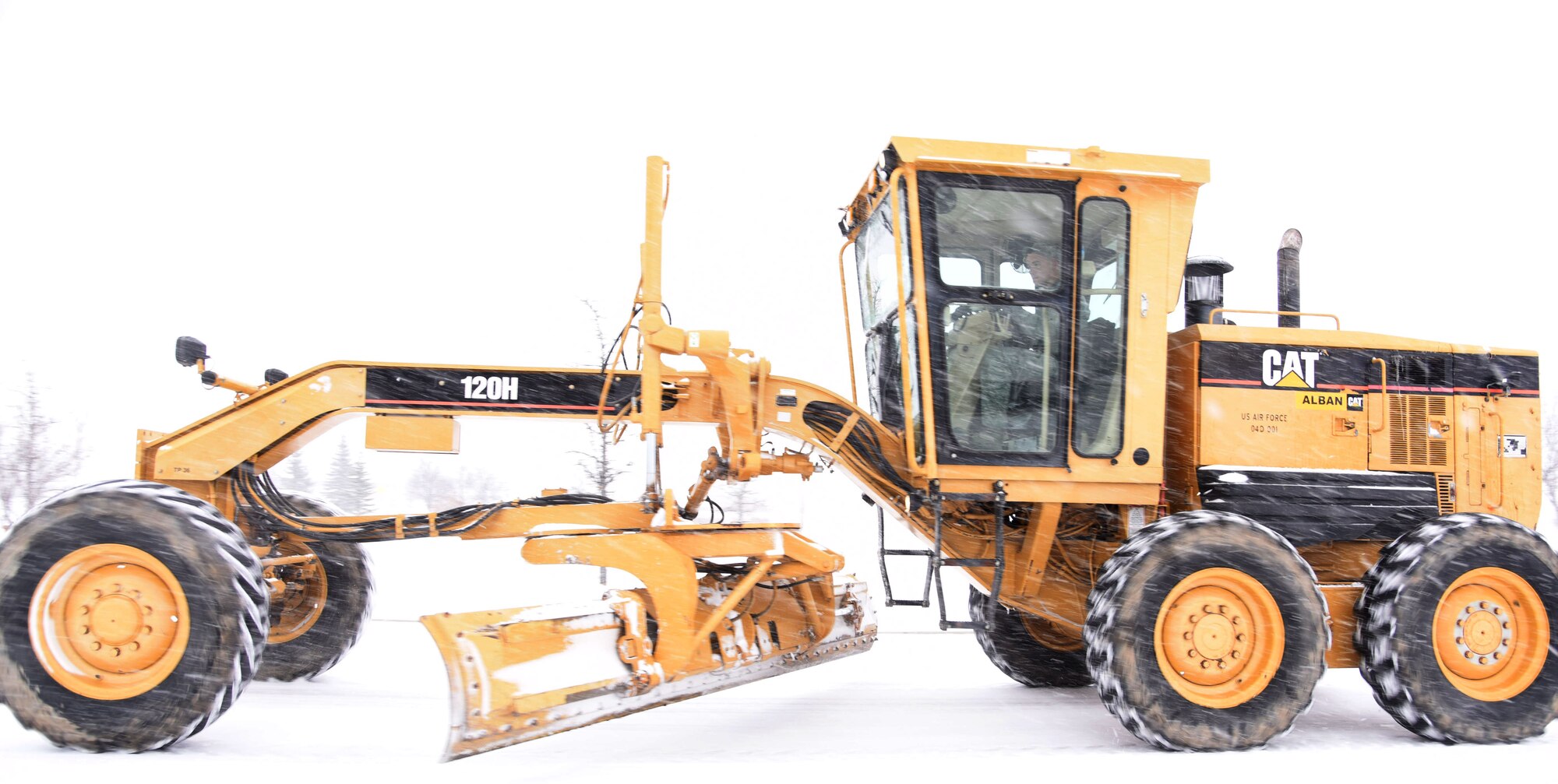 A member of the 341st Civil Engineer Squadron at Malmstrom Air Force Base, Mont., plows a road Nov. 24, 2015, at the beginning of the snowfall season. In addition to annual training, two weeks of hands-on snow equipment training was performed to ensure operators were mission ready before the first snowfall. (U.S. Air Force photo/Airman Collin Schmidt)