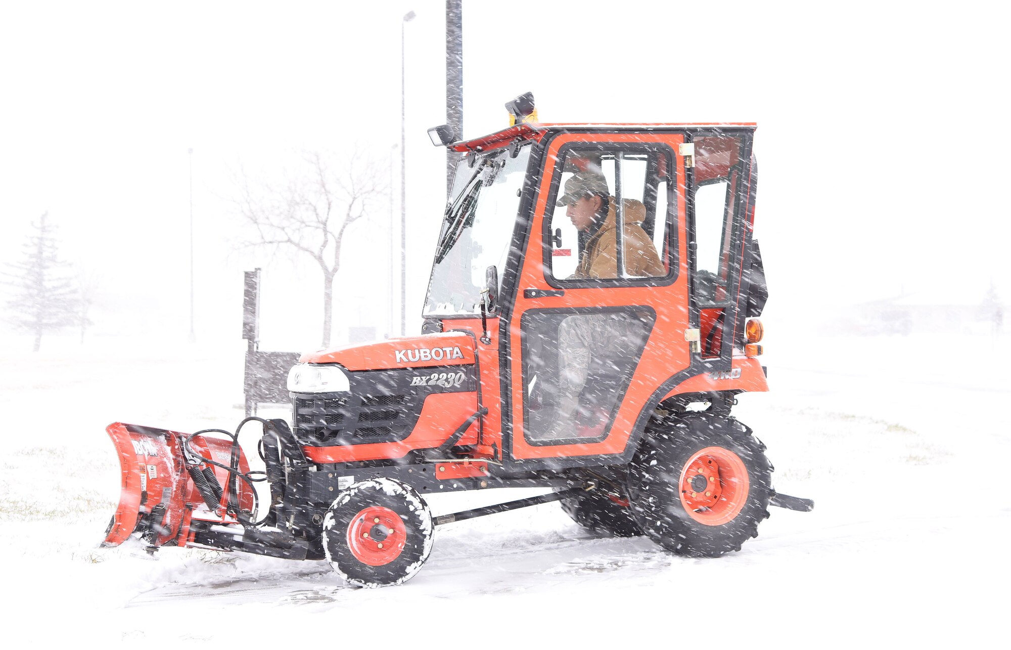 A member of the 341st Civil Engineer Squadron at Malmstrom Air Force Base, Mont., plows a road Nov. 24, 2015, at the beginning of the snowfall season. Malmstrom’s 341st CES personnel, along with 10 819th Red Horse augmentees are responsible for removing snow on 26 miles of roadway, 127 acres of parking lots, 10 miles of sidewalks and the access portions to 150 missile alert and launch facilities. (U.S. Air Force photo/Airman Collin Schmidt)