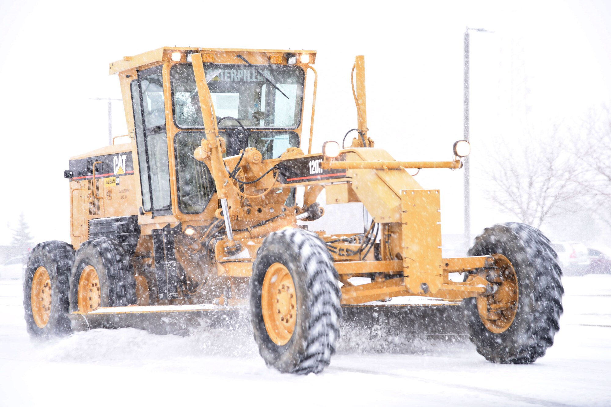 A member of the 341st Civil Engineer Squadron at Malmstrom Air Force Base, Mont., plows a road Nov. 24, 2015, at the beginning of the snowfall season. On average, Malmstrom receives 60 inches of snow annually, according to 341st CES personnel. (U.S. Air Force photo/Airman Collin Schmidt) 