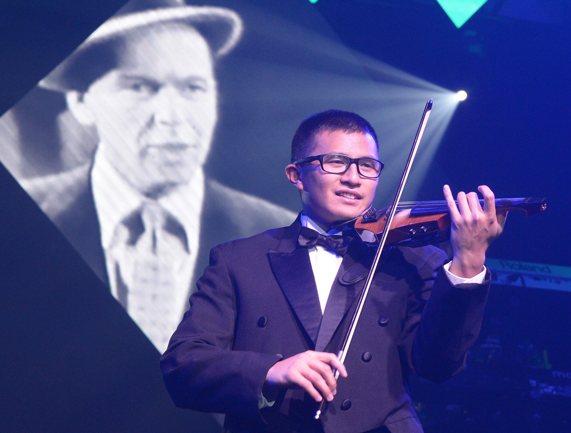 1st Lt. Oliver Chang plays Frank Sinatra's My Way during a Tops in Blue performance Nov. 20 at Peery's Egyptian Theater, Ogden, Utah. Each year the Air Force selects its most talented active duty members to form an expeditionary entertainment unit whose primary purpose is to travel the world entertaining military personnel and their families. (U.S. Air Force photo/Alex R. Lloyd)