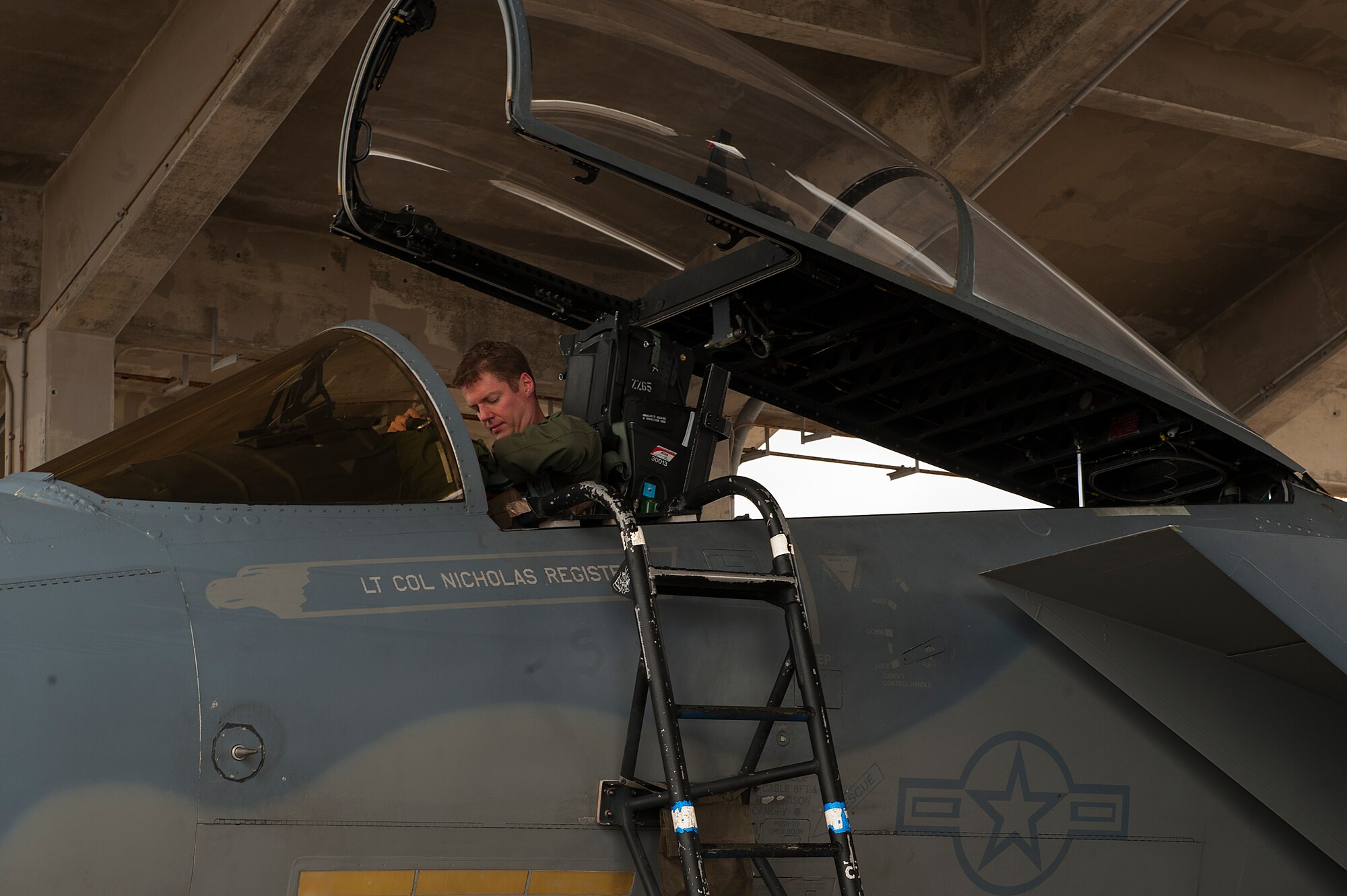 U.S. Air Force Lt. Col. Alexander Haddad, 44th Fighter Squadron pilot, exits an F-15 Eagle after reaching 2,000 flying hours Nov. 19, 2015, at Kadena Air Base, Japan. Lt. Col. Haddad is the fifth Kadena F-15 pilot to reach 2,000 flying hours since 2009. (U.S. Air Force photo by Airman 1st Class Corey M. Pettis)