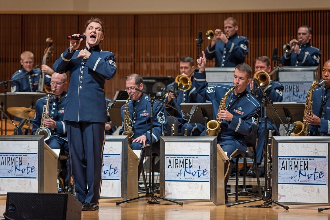 Vocalist Technical Sergeant Paige Wroble sings with The Airmen of Note recently as part of a performance with renowned jazz saxophonist Walt Weiskopf. The performance, at the Clarice Smith Center for the Performing Arts at the University of Maryland, was the final installment in the band's 2015 Jazz Heritage Series. (U.S. Air Force Photo by Senior Master Sgt Bob Kamholz/released)