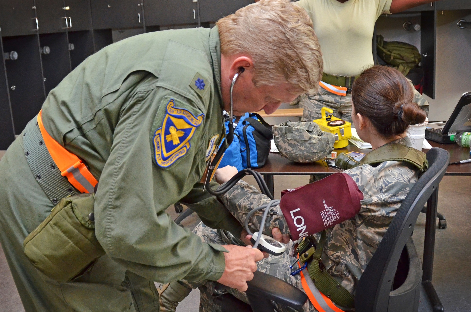 Maj. Carlissa Carson, Deputy Staff Judge Advocate, 117th Air Refueling Wing gets checked out by Lt. Col. Edward Jones, flight surgeon, 117th Medical Group as part of a deployment training exercise in Gulfport, Mississippi June 24, 2015. (U.S. Air National Guard photo by: Senior Master Sgt. Ken Johnson/Released)