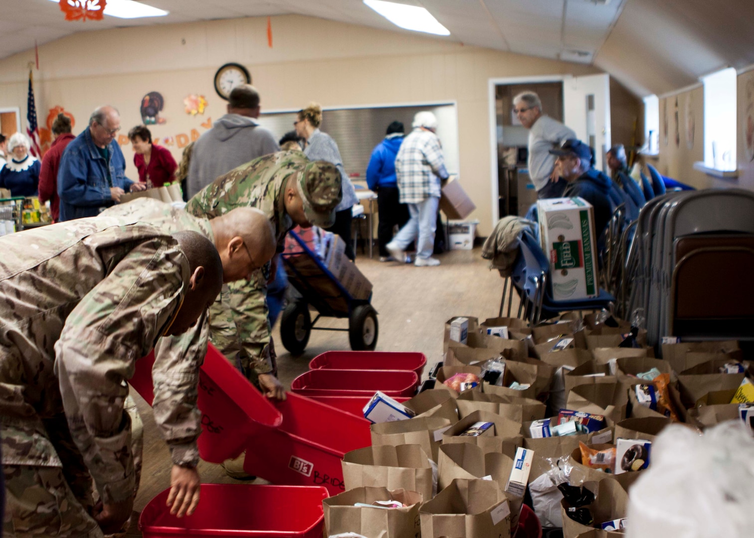Military members stationed at Defense Distribution Center, Susquehanna, work to load meals to be delivered to shut-ins at the West Shore Senior Center on Nov. 20. 

