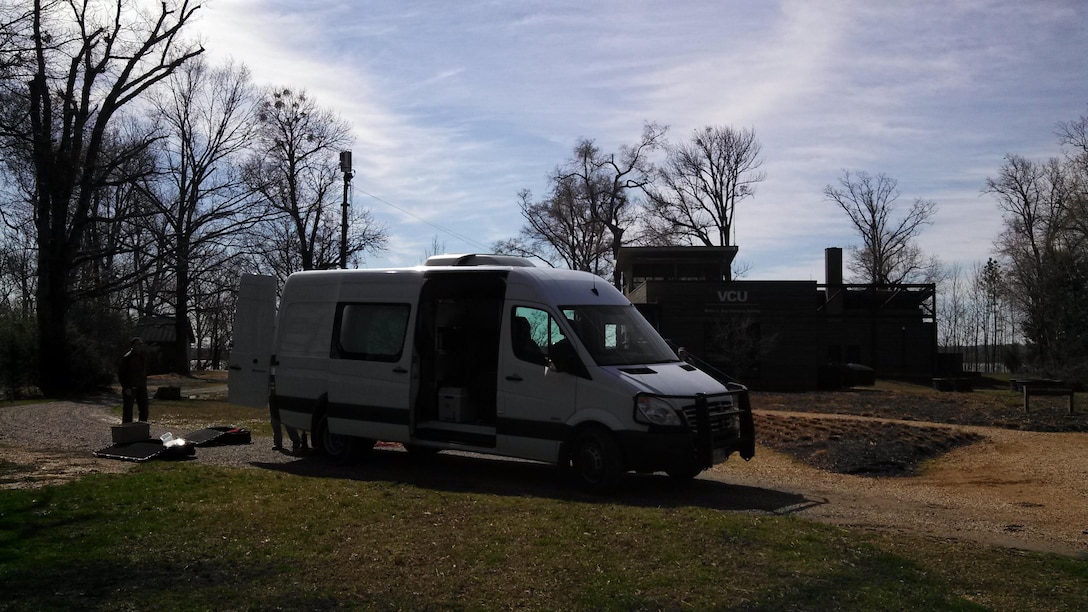 The ERDC-GRL research van with the mast-deployed LiDAR scanner, preparing for foliage penetration and change assessment tests at the VCU Rice Center.