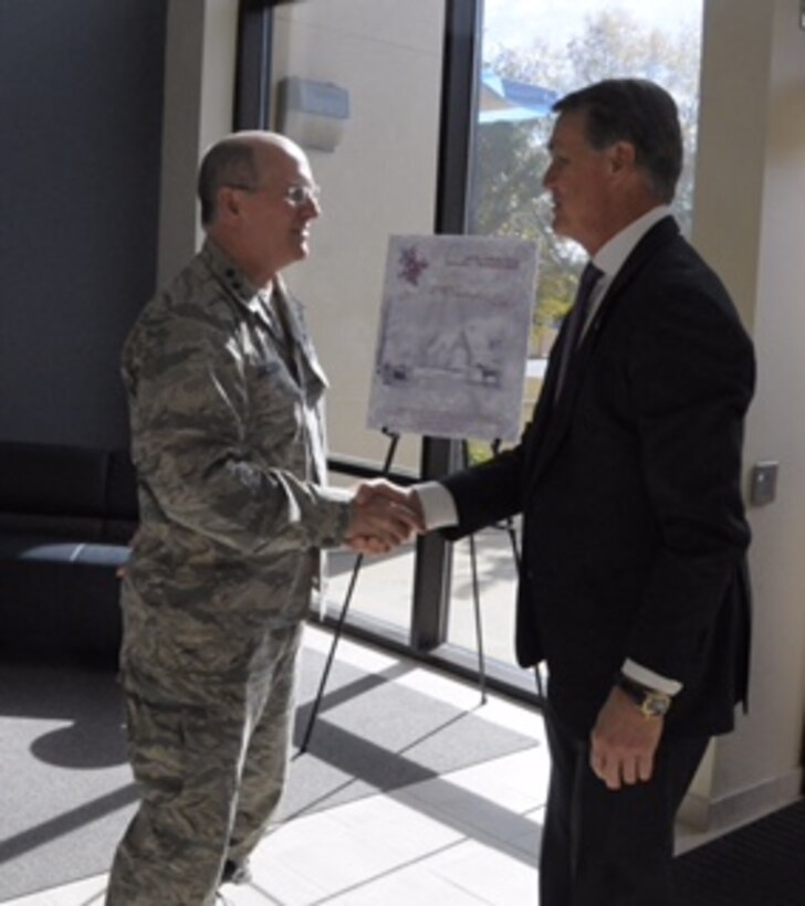 Lt. Gen. James Jackson, chief of Air Force Reserve, Headquarters U.S. Air Force, Washington, D.C., and Air Force Reserve Command commander, welcomes U.S. Senator David Perdue, (R) Georgia, to HQ AFRC, Robins Air Force Base, Georgia, Nov. 24, 2015. (U.S. Air Force photo by Robert Helton/RELEASED)