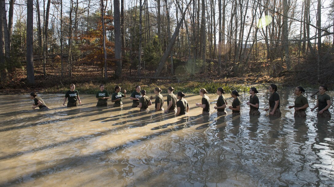 Candidates in Officer Candidate School receive their Eagle, Globe and Anchor during an exercise at Marine Corps Base Quantico, Virginia. Nov. 20, 2015. Class OCC-220 graduated and were commissioned as second lieutenants after 10 weeks of physically and mentally demanding training. (U.S. Marine Corps photo by Lance Cpl. Erasmo Cortez III)