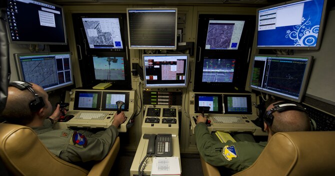 An MQ-9 Reaper pilot and sensor operator fly a training mission from a ground control station at Holloman Air Force Base, New Mexico. (U.S. Air Force photo by Airman 1st Class Michael Shoemaker)