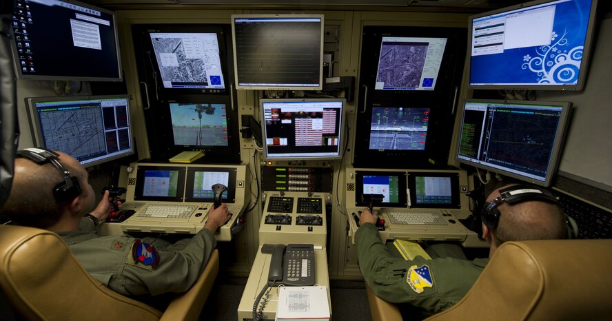 An MQ-9 Reaper pilot and sensor operator fly a training mission from a ground control station at Holloman Air Force Base, New Mexico. (U.S. Air Force photo by Airman 1st Class Michael Shoemaker)