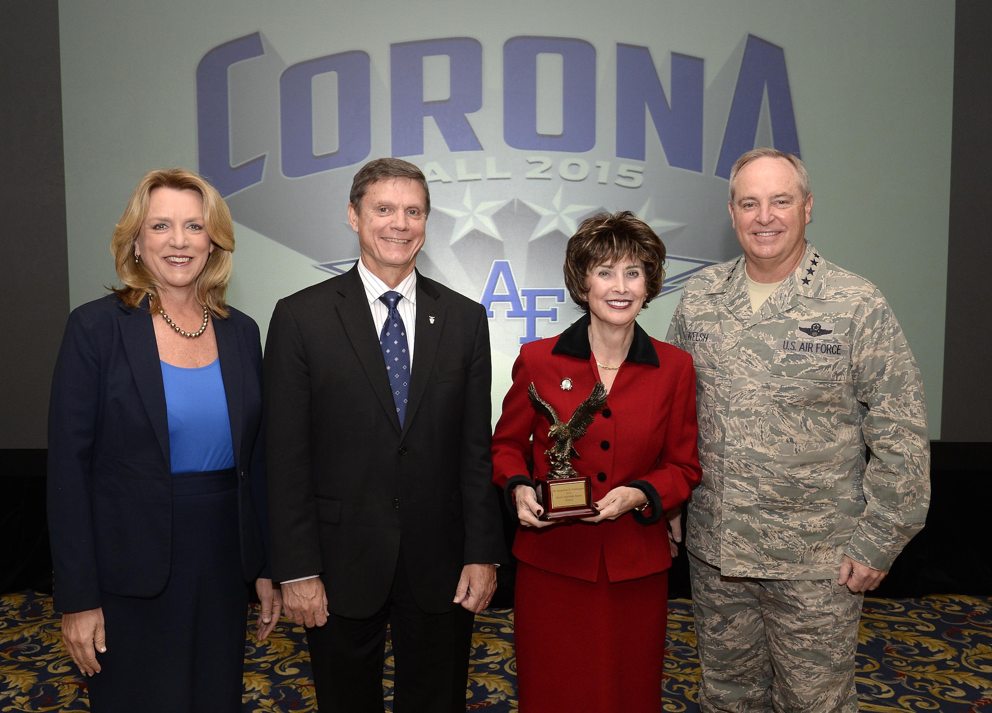Secretary of the Air Force Deborah Lee James and Air Force Chief of Staff Gen. Mark A. Welsh III join Kevin Williams, the director of Air Force Studies, Analyses and Assessments, and Jacqueline Henningsen following the presentation of the Kent award at the Corona summit Nov. 4, 2015. The Kent award recognizes influential leaders with substantive analytic responsibilities during their career, whose vision and leadership have had a significant and lasting effect on the achievements of Air Force analysis. (U.S. Air Force photo/Scott Ash)