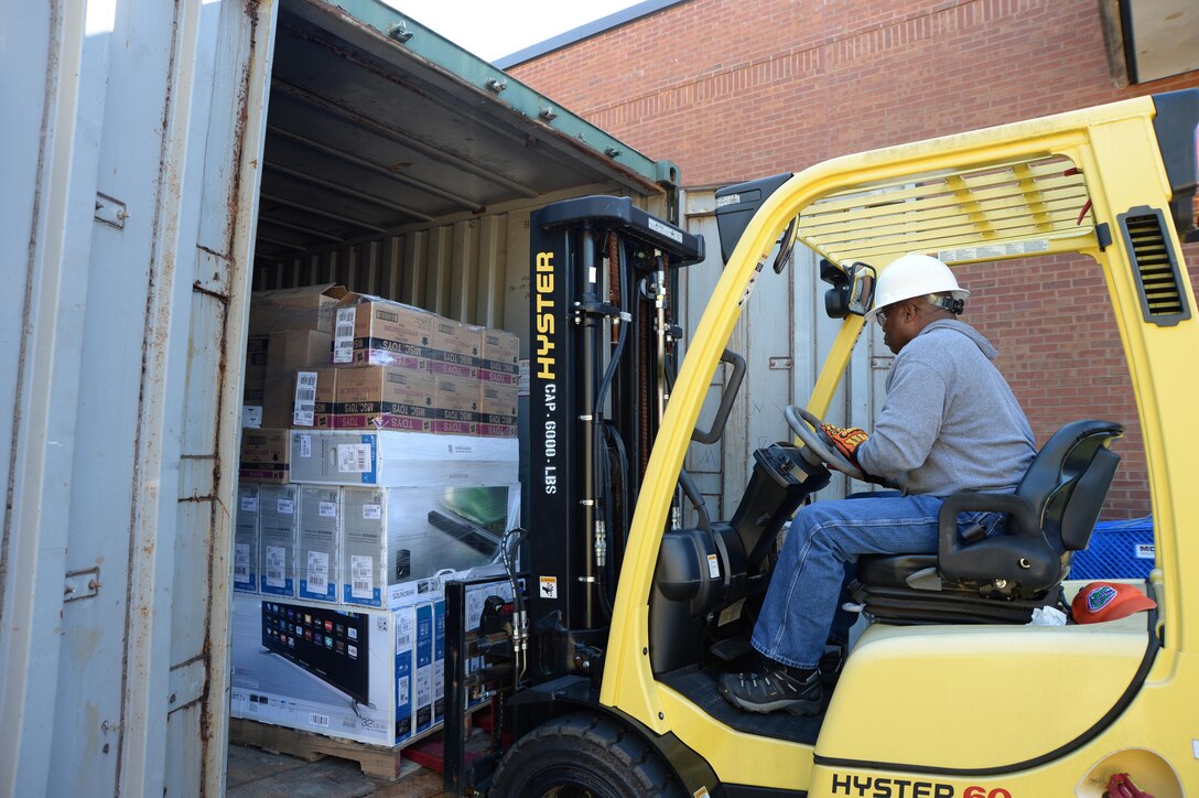 Samuel Bailey, property manager, Marine Corps Community Services, loads a pallet of merchandise onto a forklift to prepare for the Black Friday Doorbusters sale to be held Nov. 27 aboard Marine Corps Logistics Base Albany.