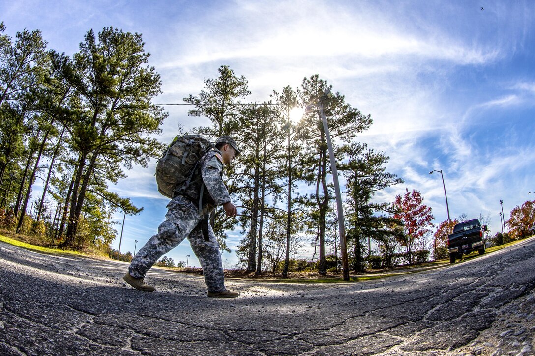 Army Capt. D.J. Joo marches toward the finish line of a 14-mile road march carrying a 55-pound ruckpack during the assessment phase of Best Ranger Competition on Fort Jackson, S.C., Nov. 24, 2015. Joo is competing for a spot on a two-soldier team that will represent the post during the Army’s 33rd anniversary of the Best Ranger competition held in April of next year at Fort Benning, Ga. U.S. Army photo by Sgt. 1st Class Brian Hamilton