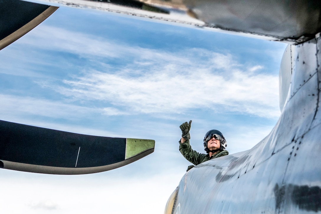 U.S. Navy Capt. Christopher Bolt gives a thumbs up out of an E-2C Hawkeye during a safety check aboard the USS Ronald Reagan before takeoff in waters south of Japan, Nov. 22, 2015. Bolt is the commanding officer of the Ronald Reagan.. U.S. Navy photo by Petty Officer 3rd Class Ryan McFarlane